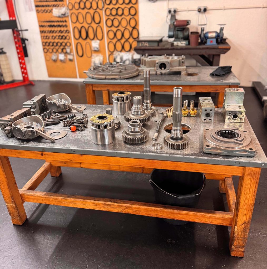 JSG Hydraulics repair shop with parts on display